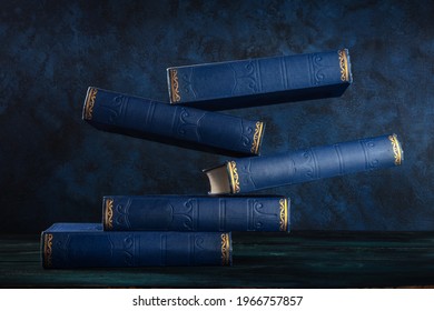 Old books, floating on a blue background