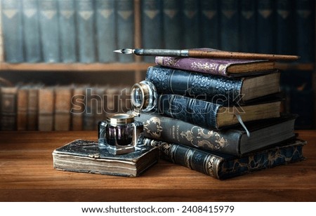 Old books , Fountain pen and vintage inkwell in old library. Conceptual background on history, education, ancient, literature topics. Translation of book titles - ancient history.