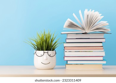 Old books on a table, with one book open and copy space for your text - Shutterstock ID 2323311409