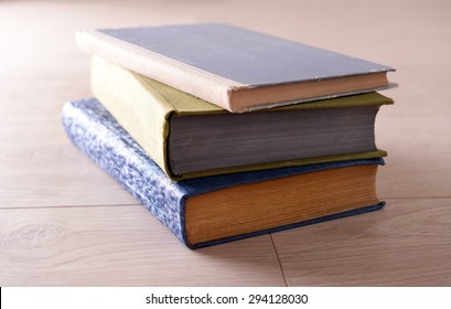Old books on wooden background - Powered by Shutterstock