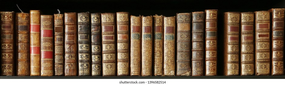 old books on wooden shelf