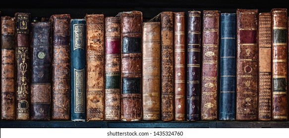 Old books on wooden shelf. Tiled Bookshelf background.  Concept on the theme of history, nostalgia, old age. Retro style. - Shutterstock ID 1435324760