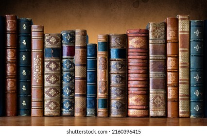 Old books on wooden shelf. Tiled Bookshelf background.  Concept on the theme of history, nostalgia, old age. Retro style. The book is a symbol of knowledge. - Powered by Shutterstock