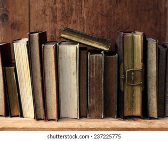 old books on wooden shelf. 