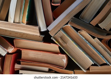 Old Books In A Pile In The Attic, Forming A Book Wall