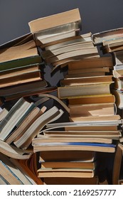 Old Books In A Pile In The Attic, Forming A Book Wall