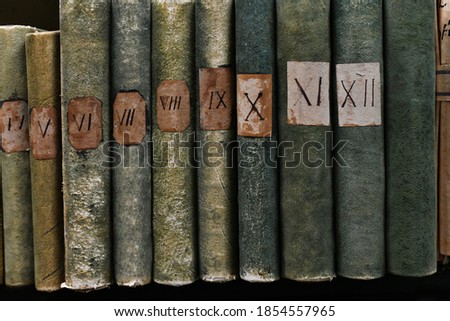 Old books with Roman numerals in the library