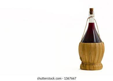 Old bottle of red wine on a white background