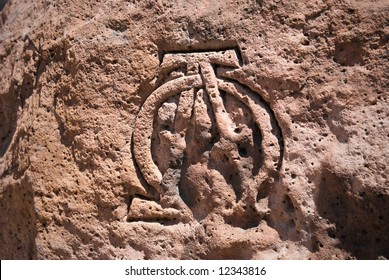 Old Boulder with the greek symbols Alpha and Omega carved into it