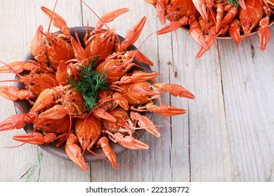 Old Bowl With Red Boiled Crawfish On A Wooden Table In Rustic Style, Close-up, Selective Focus On Some Crawfishes