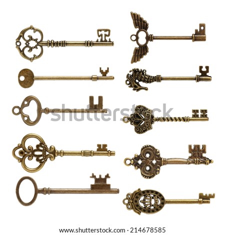 old brass key against a white background