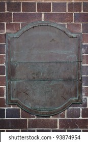 Old Brass Plaque On A Brick Wall