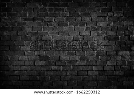Old brick black colour wall. Vintage background