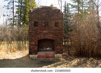 Old Brick Fireplace Remains In The Woods From An Old Ranch House