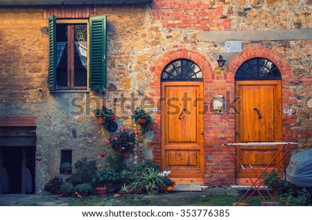 old brick italian facade stylized vintage hipster with two doors and a window