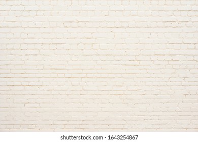 Old brick wall background painted yellow. - Shutterstock ID 1643254867