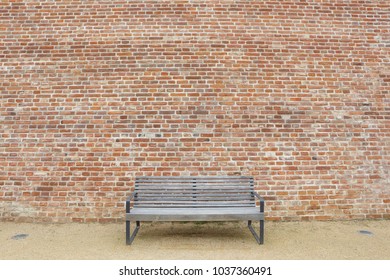 old brick wall and bench