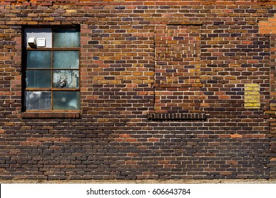 Old Brick Wall With Brick Filled Window.