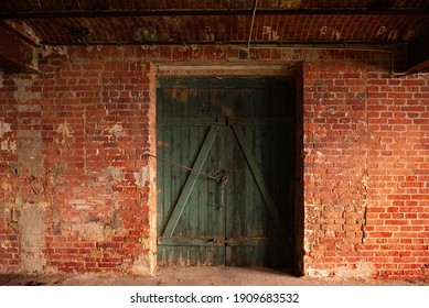 Old Brick Wall With Green Wooden Door