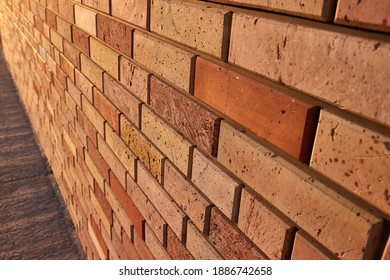 Old brick wall house texture with lights and shadows from sunlight