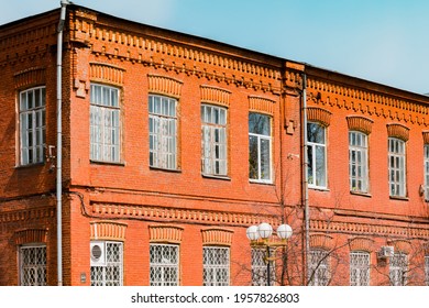 Old Brick Wall Industrial Factory Building Corner In Sunlight Blue Sky. Architect. Architecture. History. Heritage. Design. Grunge Urban. Industrial Style. Red Brick Wall