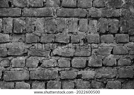 An old brick wall with patters as an  Abstract in black and white