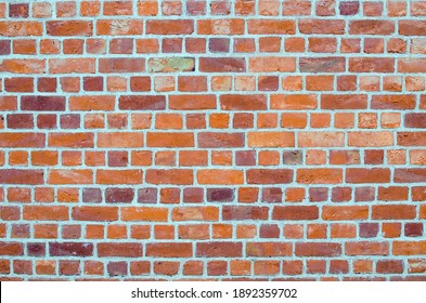 Old brick wall. Rustic old brickwork. The structure and pattern of a destroyed stone wall. Copy space