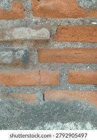 old brick wall texture background with rough cement and weathered surface red brick masonry with grunge texture perfect for construction. industrial and vintage design projects. high resolution background texture.