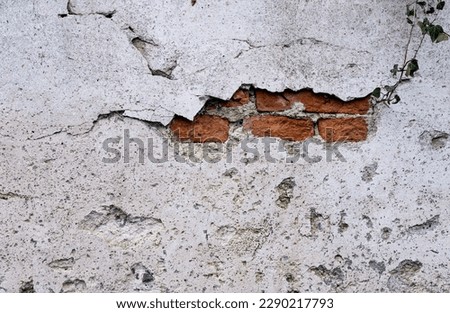 Old Brick Wall Texture Background with Peeling White Paint. Exterior  English Heritage Building Grunge Red Stonewall Facade With Damaged Plaster. Abstract Crack Wall Surface backdrop