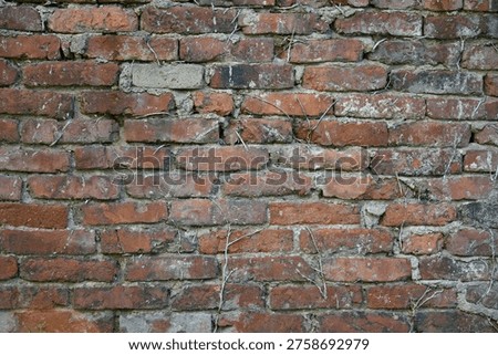 Old brick wall traces of time exposure to the elements masonry background texture stone