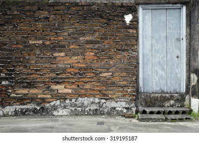 Old Brick Wall And A Wooden Door