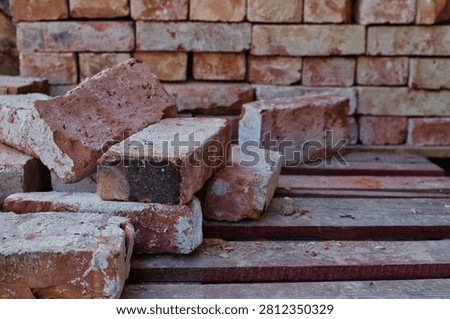 Old bricks infront of pile of bricks