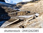 Old bridge in the empty Soboth water reservoir in Austria