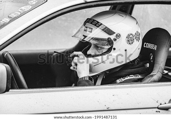 Old Bridge, New Jersey - May 29, 2021:\
East Coast Bash at Raceway Park - Driver on the radio with his team\
while he waits for his next go around the\
track