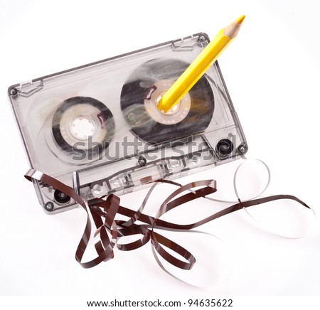 Old broken cassette isolated on white