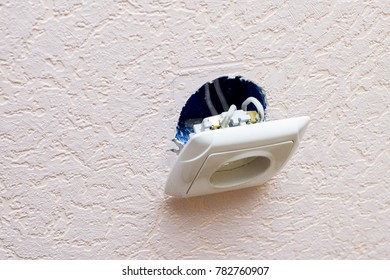 Old Broken Electrical Socket Fell Out Of Wall.