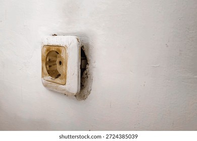 Old Broken Electrical Wall Socket With Exposed Installation