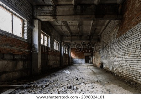 Old broken empty abandoned industrial building interior.