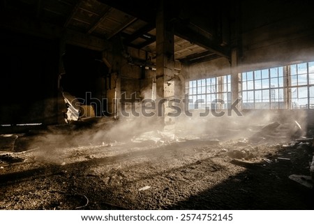 Old broken empty abandoned industrial building interior.