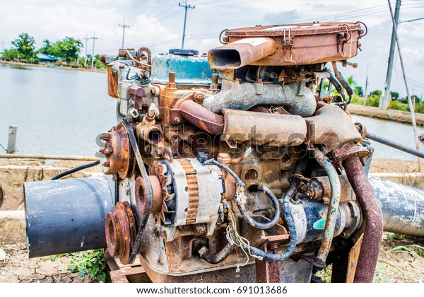 Old and broken engine for pumping in fish pond and\
shrimp pond