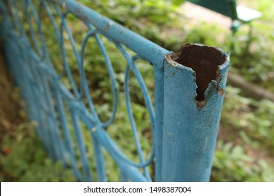 Old Broken Fence In Blue In The Garden