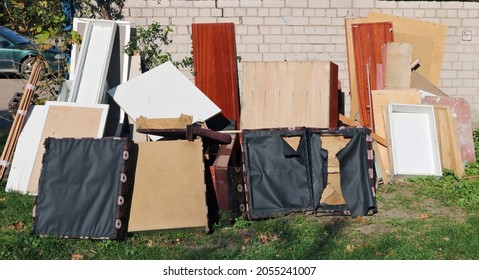 Old  Broken Furniture At The Garbage Dump  Near The  Brick Home