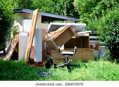 Old Broken Furniture Next To The Garbage Can