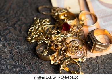 Old And Broken Jewelry  And On Euro Banknotes On Dark Background. Sell Gold For Money  Concept. 