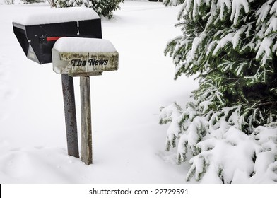 old broken mailboxes, newspaper boxes and trees covered in the snow