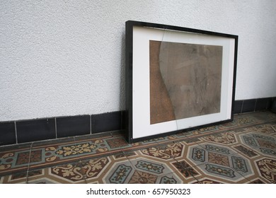 Old Broken Picture Frame On Vintage Floor