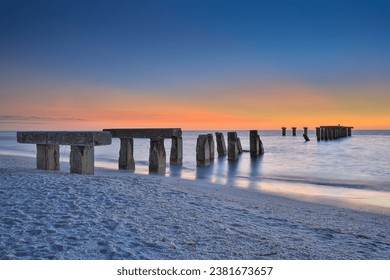 An old broken pier on the Florida island of Boca Grande just after sunset. - Powered by Shutterstock