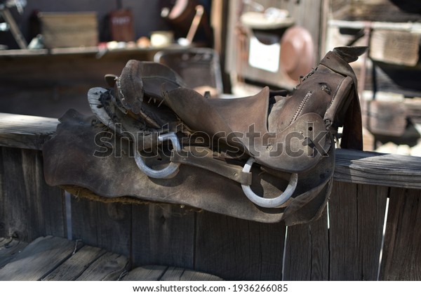 Old broken saddle in a\
western village