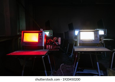 Old broken Soviet computers in abandoned computer hall.