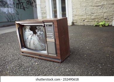 An Old Broken TV Left On The Street.